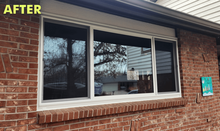 A new white-framed triple pane window installed in the brick wall of a house with the word "AFTER" displayed above.