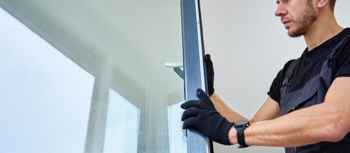 Installing a window in a building.